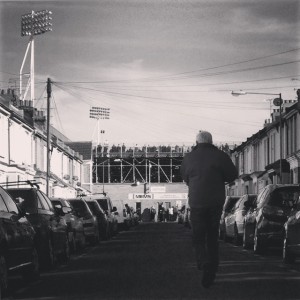 A man approaches Priestfield Stadium, just ahead of Gillingham versus Doncaster Rovers