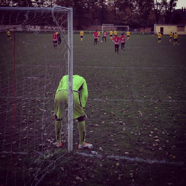 Disappointment for the Clapton goalkeeper as his team concede to FC Romania