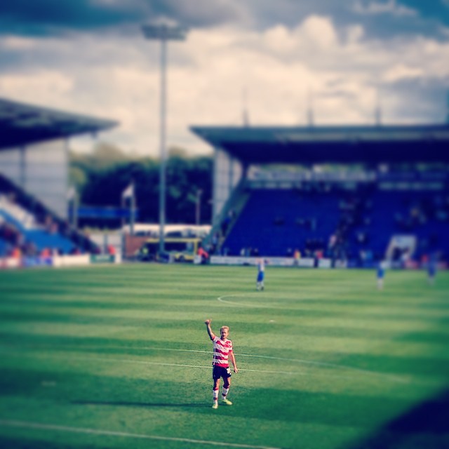 Jamie Coppinger salutes the travelling Doncaster Rovers fans after his team's victory at Colchester United