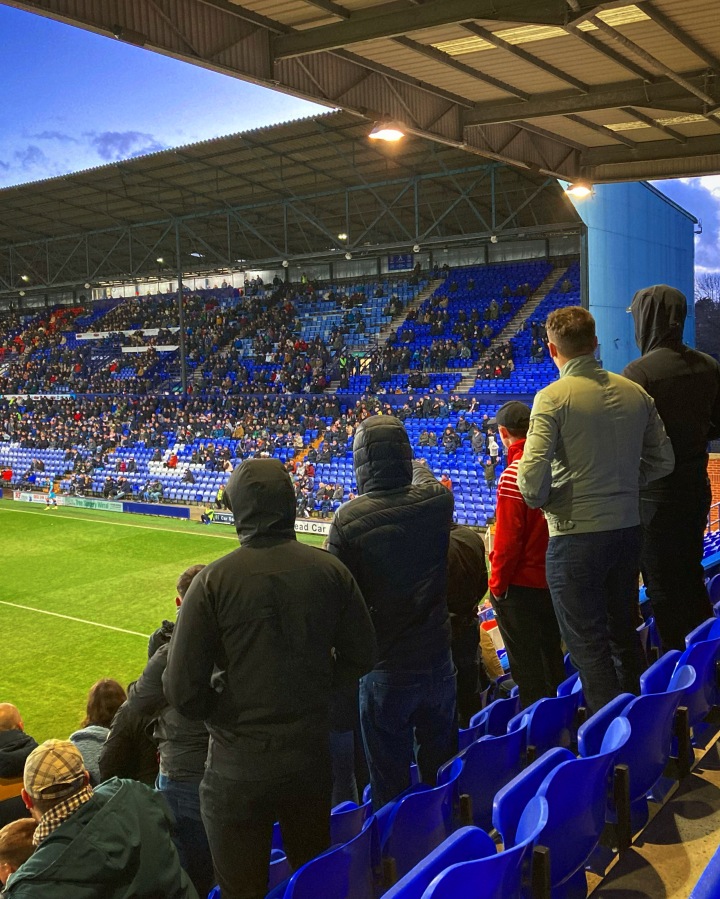 Doncaster Rovers supporters look towards Tranmere Rovers supporters during a match at Prenton Park