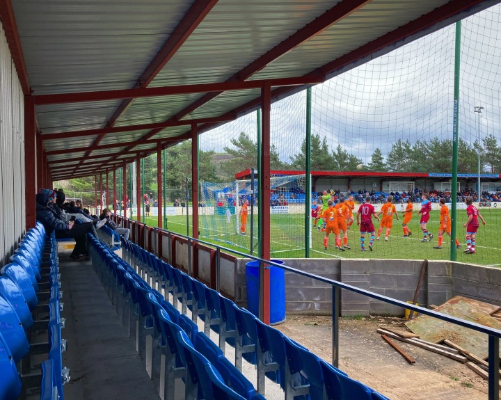 Young fans watch from behind the goal as Conwy Borough defend a corner agaisnt Colwyn Bay