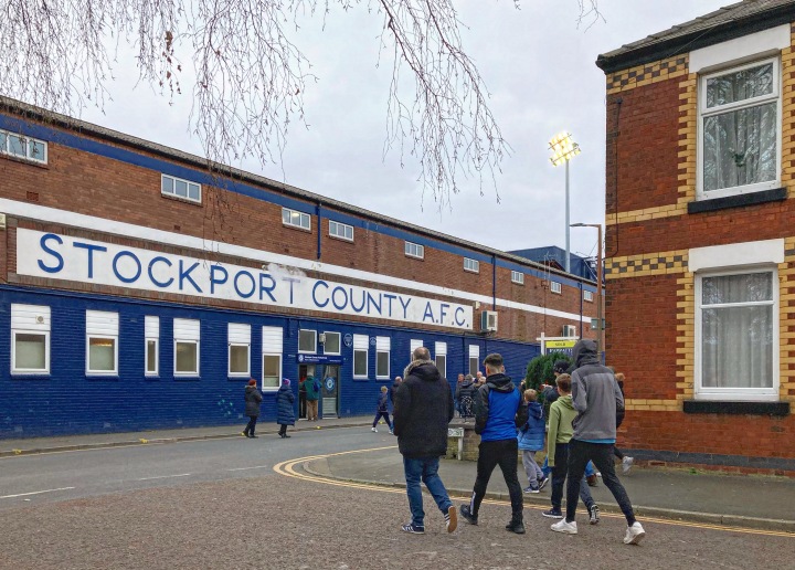 Supporters walk towards Stockport County's Edgeley Park ground