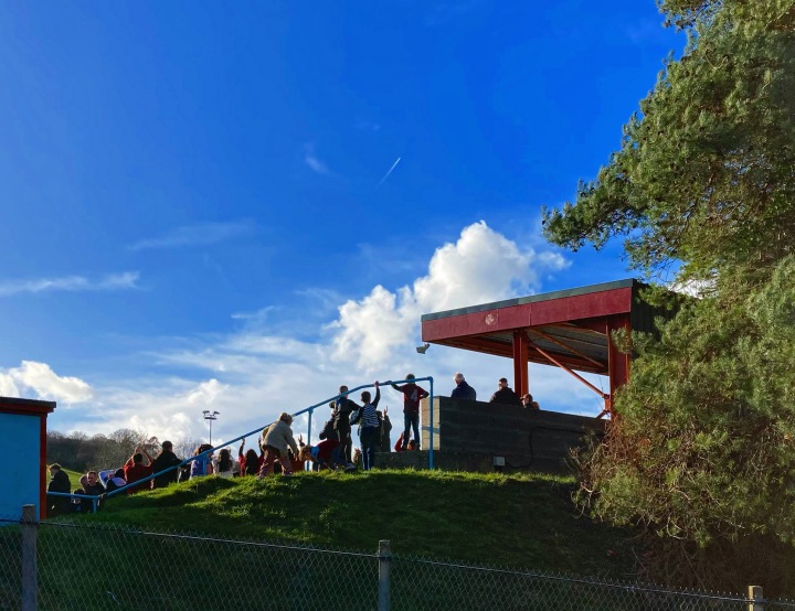 Supporters can be seen inside the ground at Colwyn Bay