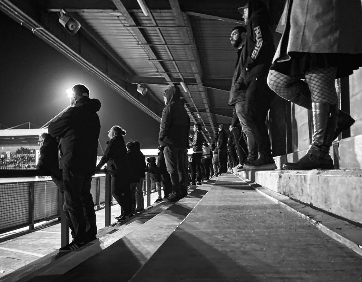 A low view of Doncaster Rovers fans on the terrace at Crawley Town